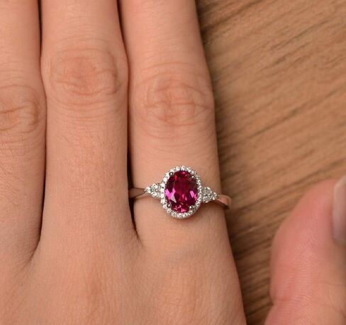 Yaya Elegant 925 Silver Plated Oval Cut Simulated Ruby Halo Engagement Ring Birth Stone Halo Solitaire Ring for Women in Kuwait