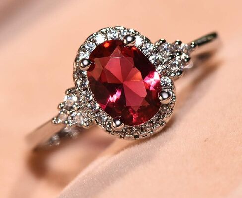 Yaya Elegant 925 Silver Plated Oval Cut Simulated Ruby Halo Engagement Ring Birth Stone Halo Solitaire Ring for Women in Kuwait