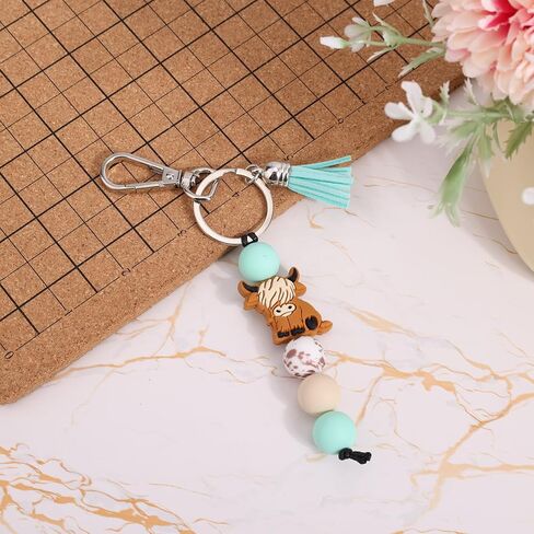 Highland Cow Keychain with Beads & Tassel, Cute Silicone Highland Cow Keyring for Car & Bag Decoration Accessories in Saudi Arabia