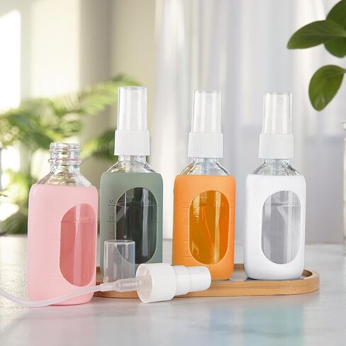 HOMBYS Empty Clear Glass 2oz Small Spray Bottles with Silicone Sleeve Protection - Refillable Containers for Travel, Cleaning Solutions, Essential Oils, Sanitizers - Fine Mist Spray - 4 Pack-Clear in Saudi Arabia