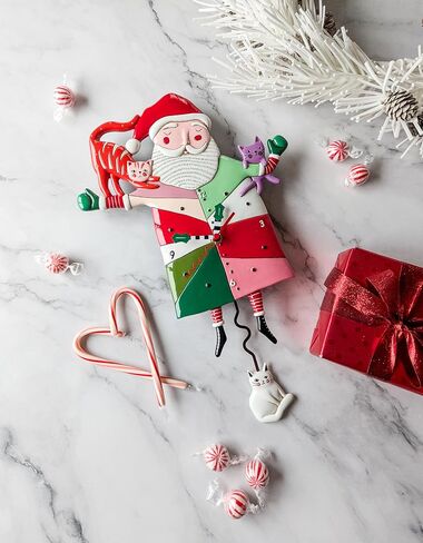 Enesco Allen Designs Crazy Cat Santa Wall Clock - Battery Operated Pendulum Analog Clock, Stone Resin Decorative Clocks for Walls Home Decor Kitchen Clock, 12.6 Inch in Saudi Arabia
