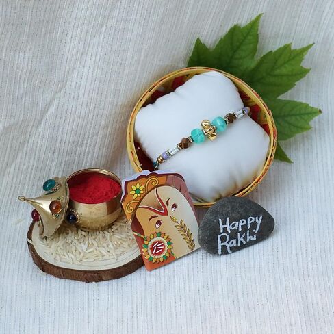 Rakhi Gift Box | Rakhi Gift Hamper made with a Blue and Gold Rakhi, Roli, Chaval, Mini Thali Set, and a Greeting Card and a delectable | Rakhi Gift Set | Rakhi Hamper (Rakhi Set 5) in Kuwait