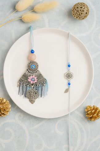Aijani Bhaiya Bhabhi Rakhi مع Evil Eye & Lotus Design | مجموعة Rakhi المطلية بالفضة العتيقة مع الخرز ، الشرابات وسحر الأوراق | هدية راكشا بانهان لأخ وأخت زوجة in Saudi Arabia