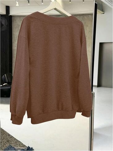 WDIRARA Women's V Neck Letter Graphic Oversized Sweatshirt Long Sleeve Drop Shoulder Pullover Top in Saudi Arabia