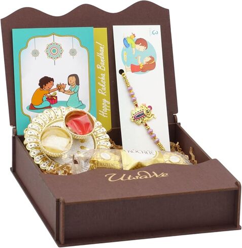 UtsaWe Rakhi Gift Box | Rakhi Gift Hamper made with a Divine Laxmiji Rakhi, Roli, Chaval, Mini Thali Set, Greeting Card, and Chocolates | Rakhi Gift Set | Brother Rakhi | Rakhi Bracelet Hamper (Laxmiji Rakhi) in Kuwait