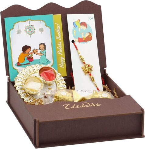 UtsaWe Rakhi Gift Box | Rakhi Gift Hamper made with a Divine Laxmiji Rakhi, Roli, Chaval, Mini Thali Set, Greeting Card, and Chocolates | Rakhi Gift Set | Brother Rakhi | Rakhi Bracelet Hamper (Laxmiji Rakhi) in Kuwait