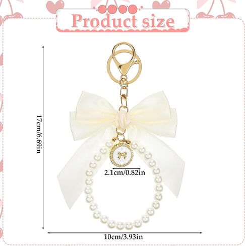 Bow keychain ، beige keychain keychain coquette keychains cute bow pres bag bag charm keychains bows key kins wistlet accessories bows for women car car base bas in Kuwait