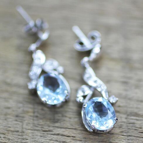 NOVICA Artisan Handcrafted Blue Topaz Dangle Earrings Sterling Silver Floral Jewelr Rhodium Plated Cubic Zirconia Clear India Leaf Tree Birthstone [1 in L x 0.4 in W x 0.2 in D] ' Dazzling Dew' in Saudi Arabia