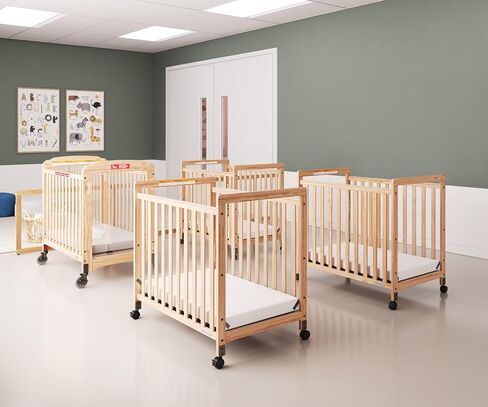 Foundations SafetyCraft Compact Slatted Daycare Crib, Durable Wood Construction, Non-Marking Casters (2 Locking), Includes 3" InfaPure Foam Mattress (Natural) in Kuwait