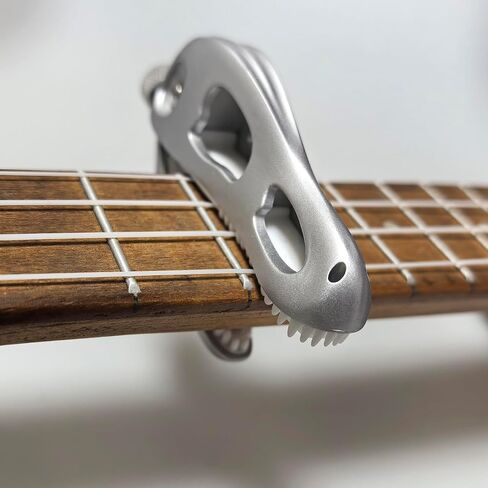 Jurassic T-Rex Guitar Capo - Dinosaur Skull Design with Silicone Teeth, Zinc Alloy Adjustable Clamp for Acoustic/Electric Guitar, Bass, Ukulele & Banjo (Silver) in Saudi Arabia