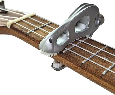 Jurassic T-Rex Guitar Capo - Dinosaur Skull Design with Silicone Teeth, Zinc Alloy Adjustable Clamp for Acoustic/Electric Guitar, Bass, Ukulele & Banjo (Silver) in Saudi Arabia