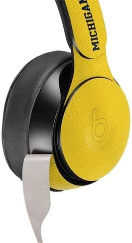 Skinit Schecal Audio Audio Skin متوافق مع Beats Solo Pro - تصميم تقسيم جامعة ميشيغان المرخصة رسميًا in Kuwait