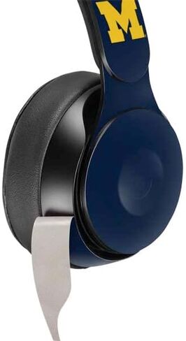 Skinit Schecal Audio Audio Skin متوافق مع Beats Solo Pro - تصميم تقسيم جامعة ميشيغان المرخصة رسميًا in Kuwait