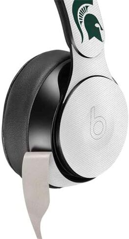 Skinit Schecal Audio Audio Skin متوافق مع Beats Solo Pro - تصميم جامعة ولاية ميشيغان المرخص رسميًا in Kuwait