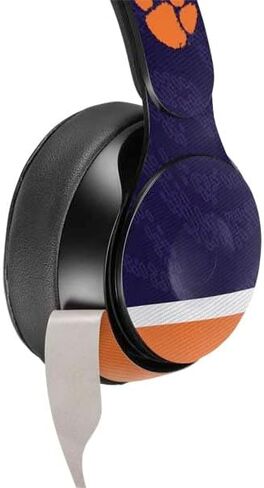 Skinit Schecal Audio Audio Skin متوافق مع Beats Solo Pro - تصميم جيرسي البرتقالي بجامعة كليمسون المرخصة رسميًا in Saudi Arabia