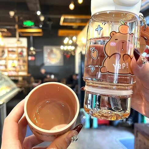 Cartoon capybara straw cup, cute sports bottle with shoulder strap, suitable for school, office, travel, and outdoor use. (760ml) in Saudi Arabia