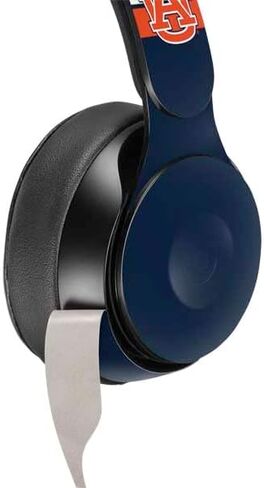 Skinit Sched Secal Audio Skin متوافق مع Beats Solo Pro - تصميم جامعة أوبورن المرخص رسميًا in Saudi Arabia