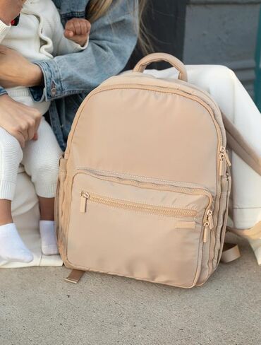 FAWN DESIGN Nylon Diaper Bag Backpack with Changing Pad, Beige Backpack Diaper Bag with 11 Interior and 5 Exterior Pockets, Padded and Adjustable Straps for All Day Comfort, 16x13x7 inches in Saudi Arabia