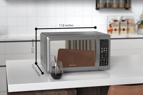 فرن ميكروويف إيمرسون MW7601SL مدمج على سطح الطاولة مع باب أنيق ذو مرآة 10 مستويات طاقة، 6 قوائم تلقائية، قرص دوار زجاجي وقفل آمن للأطفال، 0.7 قدم مكعب. قدم، فضي in Kuwait