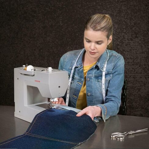 SINGER Heavy Duty 6700C Sewing Machine with Extension Table, LCD Screen, 411 Stitches, Speed Control, Built-in Needle Threader – Includes UAX Surge Protector & 12-Month CPS Protection Plan in Saudi Arabia
