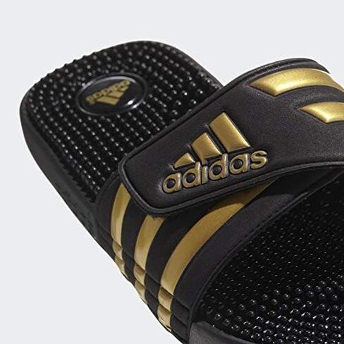 adidas Men's Adissage Slides Sandal, Black/Gold Metallic/Black, 11 in Saudi Arabia