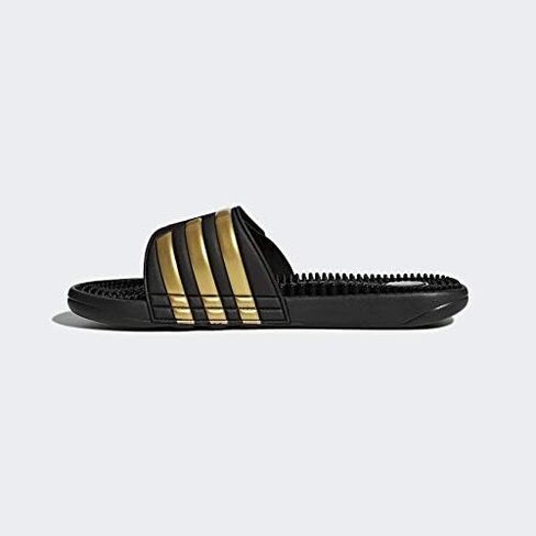 adidas Men's Adissage Slides Sandal, Black/Gold Metallic/Black, 11 in Saudi Arabia