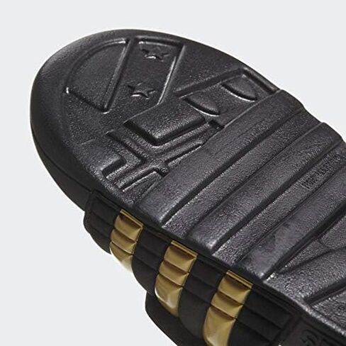 adidas Men's Adissage Slides Sandal, Black/Gold Metallic/Black, 11 in Saudi Arabia