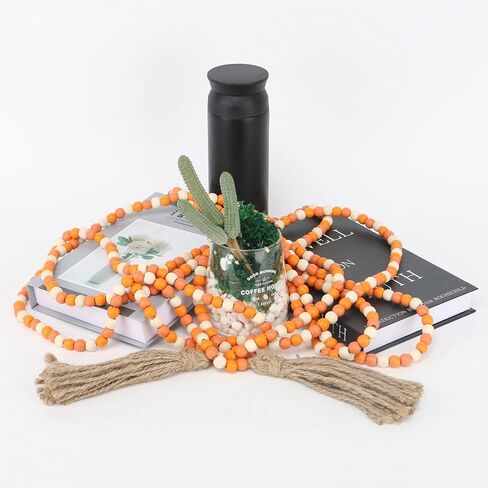 CVHOMEDECO. 16 Feet Wood Beads Garland with Tassels Farmhouse Rustic Wooden Decorative Bead String Wall Hanging Accent for Home Festival Decor. Orange in Saudi Arabia