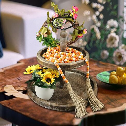 CVHOMEDECO. 16 Feet Wood Beads Garland with Tassels Farmhouse Rustic Wooden Decorative Bead String Wall Hanging Accent for Home Festival Decor. Orange in Saudi Arabia