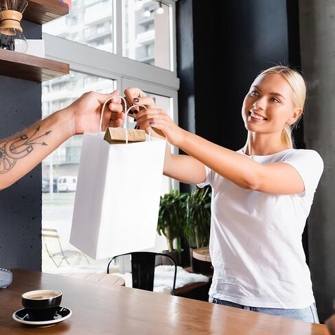 عبوة برايم لاين مقاس 8 × 4 × 10 صغيرة مكونة من 50 كيسًا ورقيًا أبيض بمقابض، وحقائب تسوق للأعمال الصغيرة، والتجزئة، والبوتيك، وحقائب هدايا للحفلات بالجملة in Kuwait