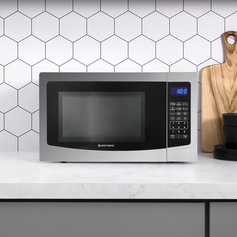 West Bend WB01100MWVW Microwave Oven Compact with 10 Power Levels and 6 Pre Cooking Settings, Speed Defrost, Electronic Control Panel and Glass Turntable, 1.1-Cu.Ft, White in Saudi Arabia