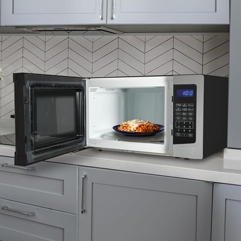 West Bend WB01100MWVW Microwave Oven Compact with 10 Power Levels and 6 Pre Cooking Settings, Speed Defrost, Electronic Control Panel and Glass Turntable, 1.1-Cu.Ft, White in Saudi Arabia