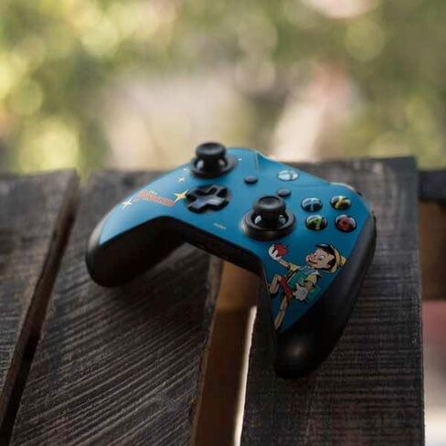 ألعاب Skinit Scenit Gaming Skin متوافقة مع جهاز التحكم Xbox One S - ديزني Pinocchio المرخص رسميًا in Saudi Arabia