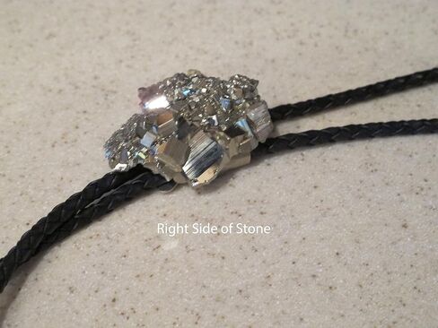 Man's Southwestern Bolo Tie featuring Pyrite or Fool's Gold with Black Leather Cords and Gold Tone Tips in Saudi Arabia