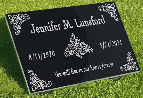 A personalized headstone made of black granite that honors loved ones forever. Cross Figure designed headstone in Saudi Arabia