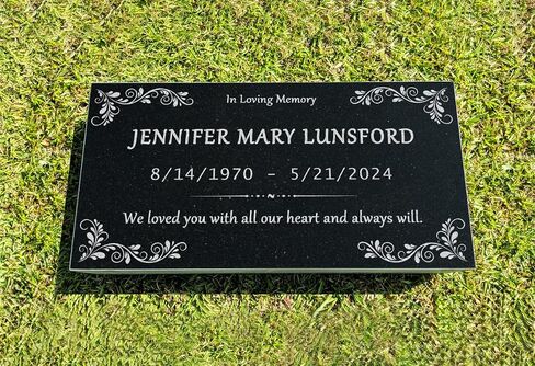 A personalized headstone made of black granite that honors loved ones forever. corners floral designed headstone in Saudi Arabia