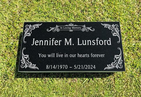 A personalized headstone made of black granite that honors loved ones forever. corners floral designed headstone in Saudi Arabia