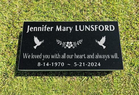 A personalized headstone made of black granite that honors loved ones forever. corners floral designed headstone in Saudi Arabia