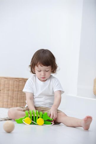PlanToys Penguin Wheelie Push Toy for Toddlers - Sustainably Made from Rubberwood Featuring Organic-Pigment Coloring and Water-Based Dyes with Waddling Action When Pushed in Saudi Arabia