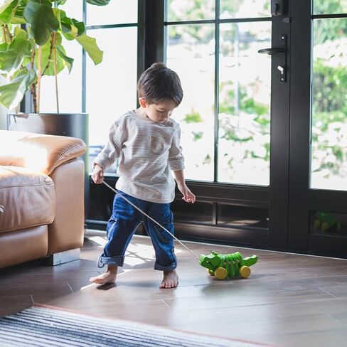 PlanToys Penguin Wheelie Push Toy for Toddlers - Sustainably Made from Rubberwood Featuring Organic-Pigment Coloring and Water-Based Dyes with Waddling Action When Pushed in Saudi Arabia