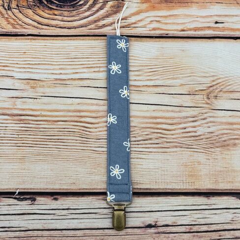 White Dainty Flowers On Blue Fabric Pacifier Clip Holder for Infant Baby Boy And Girl, Universal Fit for Binky, Soothers and Teethers in Saudi Arabia