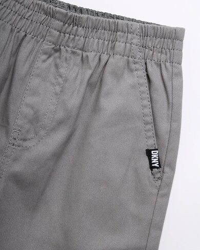 طقم سراويل للأولاد من DKNY - قطعتان من القميص المنسوج بأكمام قصيرة وسروال قماش - طقم ملابس للأولاد الصغار (2T-7) in Saudi Arabia