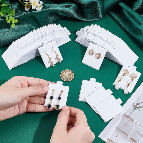 NBEADS 100 Pcs Earring Display Cards, PVC Jewelry Hanging Display Cards Puff Earring Cards Earring Holder Cards with Paper Packaging Box for Earrings Jewelry Display, White, 1.2x1Inch in Saudi Arabia