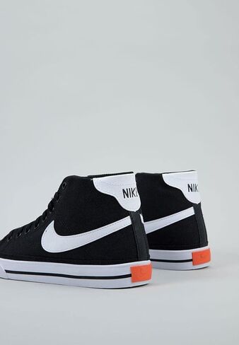 حذاء الجري Nike W Court Legacy CNVS متوسط ​​للنساء، أبيض/أسود-برتقالي، 6.5 UK (9 US) in Saudi Arabia