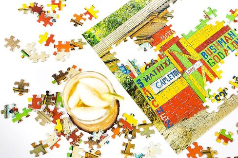 Stamp Chronicles 1000 قطعة لغز للبالغين | ألغاز بانوراما مستوحاة من الجامايكيين من قبل SG مع ملصق كامل الحجم ، وقطع مميزة ، وهدية مثالية للعائلات وعشاق الفن الكاريبي in Saudi Arabia