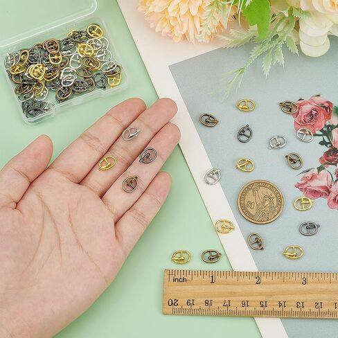 Fingerinspire 80 pcs مشبك سبيكة بيضاوية صغيرة للدمى صنع 0.4x0.31inch 4 ألوان الدبوس المعدنية الدباطية الدبوس المركزية حزام حزام البار للدمى DIY in Saudi Arabia