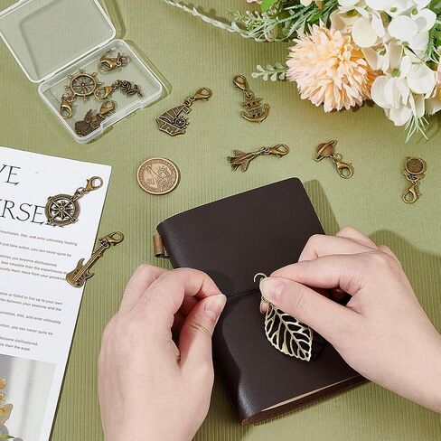 Benecreat 12 Styles Traveler's Notebook Charms Vintage ، سحر سوار مع مشابك جراد البحر لصنع المجوهرات ، ديكور دفاتر ، معلقات السبائك الذهبية العتيقة لمخطط اليومية ، القلادة ، سلسلة المفاتيح in Kuwait