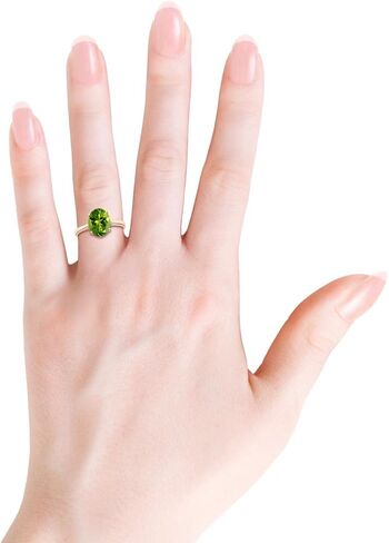 Angara Natural Oval Solitaire Peridot Cocktail Ring in Silver / 14K Solid Gold/Platinum | August Birthstone, Birthday, Engagement, Anniversary, Wedding Jewelry Gift for Women in Saudi Arabia