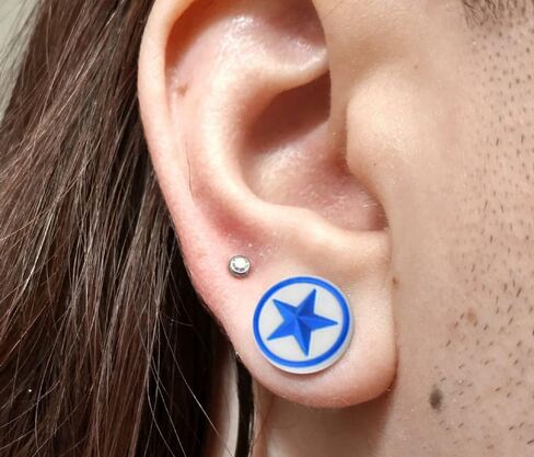 Embossed Light Blue Star on White Silicone Double Flared Tunnel Gauge Ear Plug in Saudi Arabia