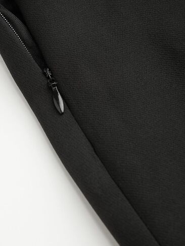 CIDER تنورة صغيرة ملفوفة بعقدة على شكل فيونكة صلبة متوسطة الخصر مبطنة بقماش منسوج قابل للتمدد قليلاً، تنانير قصيرة للنساء in Kuwait